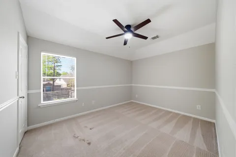 a view of a room with a big yard