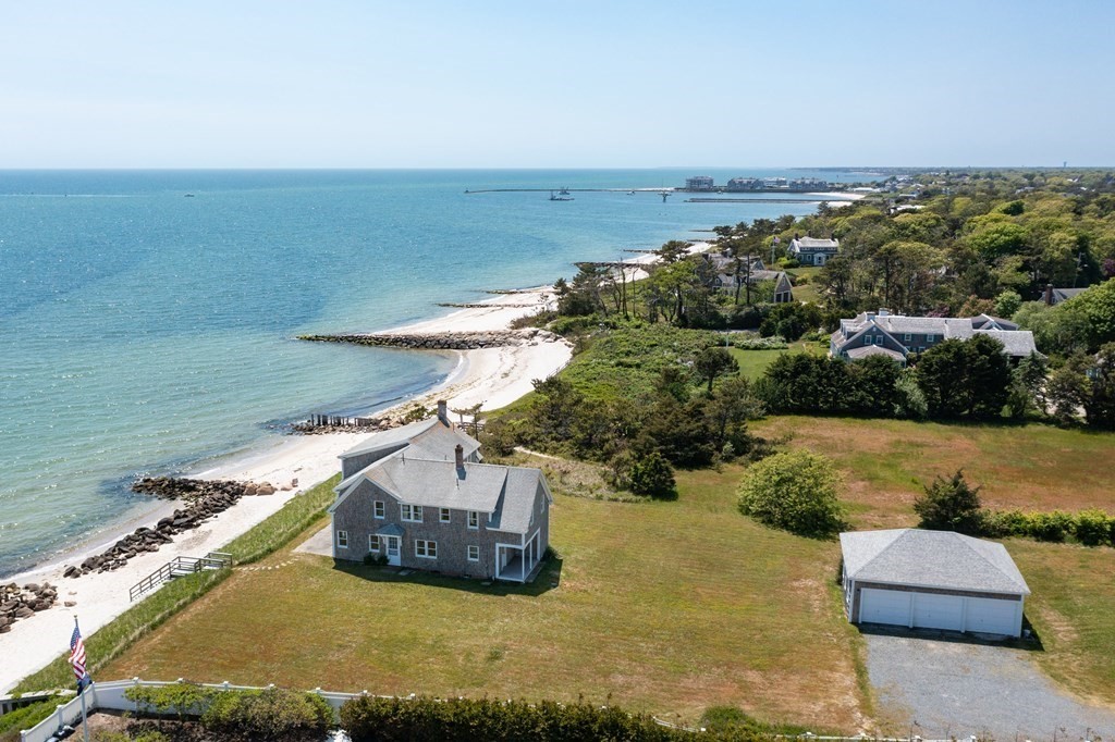 29 Walther Road Harwich, MA 02646 - Photo 2 of 8 a view of a lake with couches in front of it