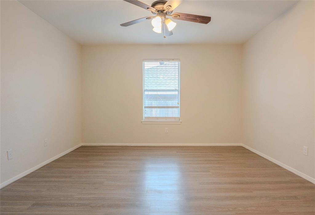 527 Crowley Road Arlington, TX 76012 - Photo 16 of 20 wooden floor in an empty room with a window