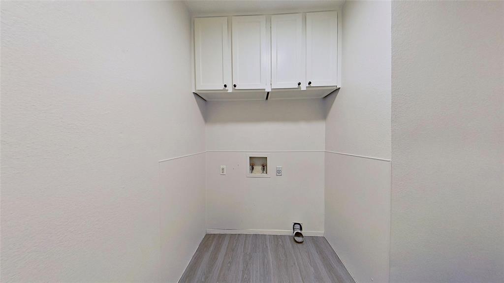 527 Crowley Road Arlington, TX 76012 - Photo 18 of 20 a view of a room with racks on the wall