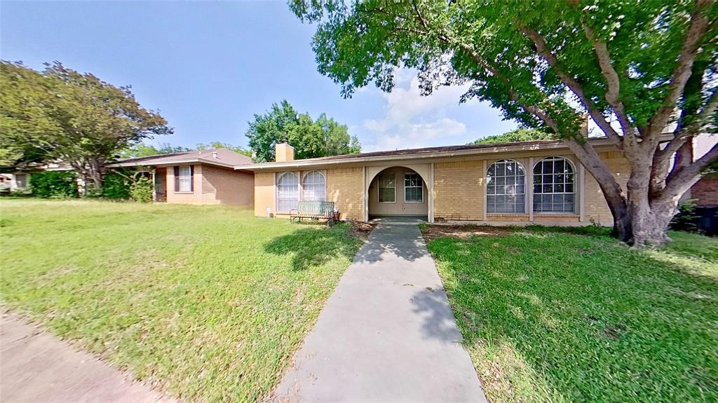 527 Crowley Road Arlington, TX 76012 - Photo 5 of 20 a front view of a house with garden