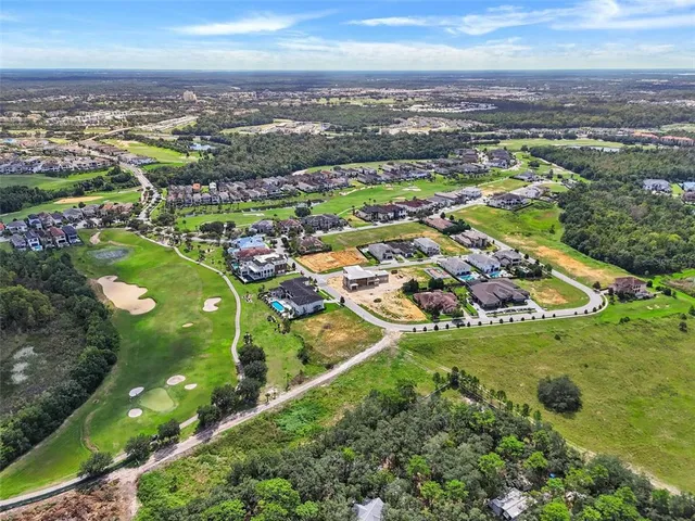 a front view of a house with a yard and outdoor seating