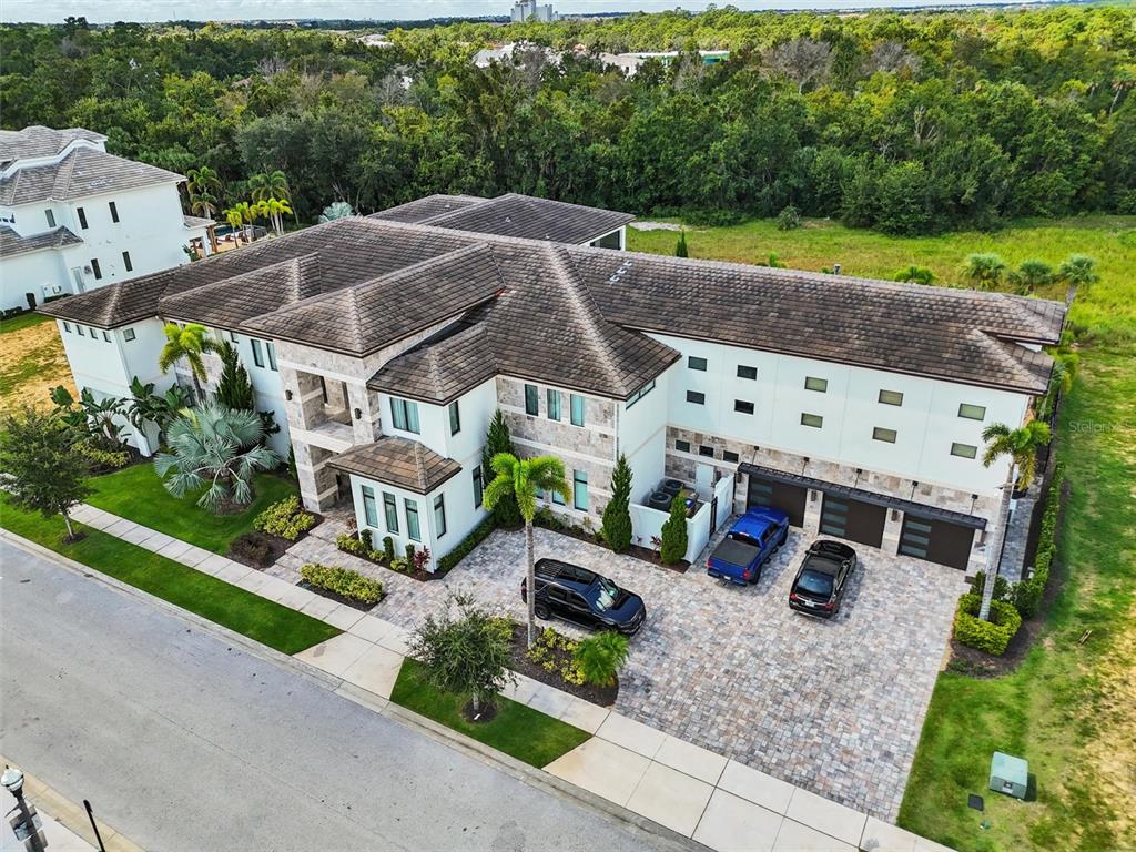 8031 Twin Eagles Loop Reunion, FL 34747 - Photo 33 of 38 an aerial view of a house with a yard basket ball court and outdoor seating
