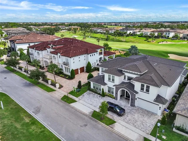 an aerial view of a yard with a patio