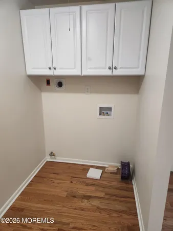 a view of cabinets with wooden floor