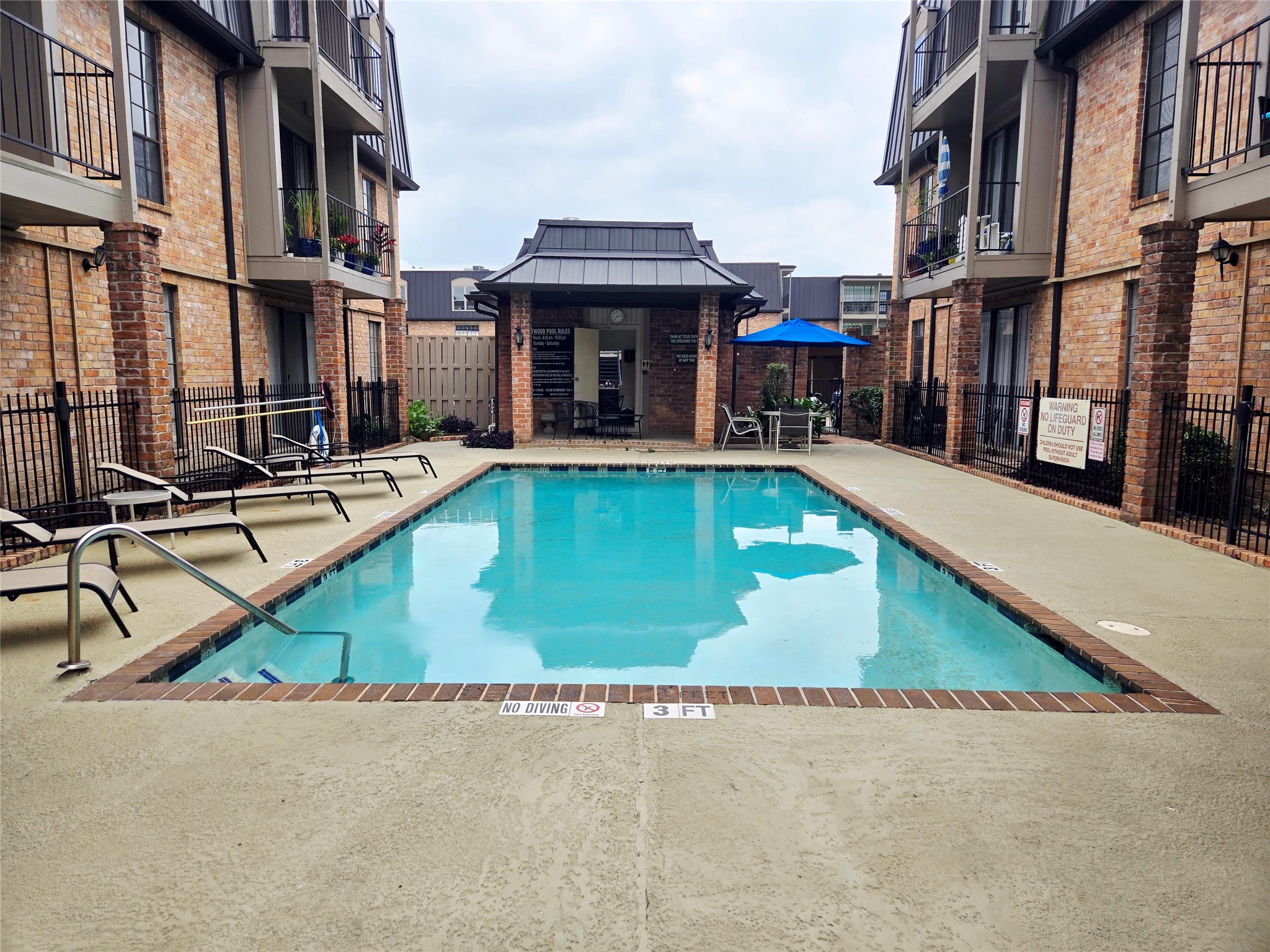 2425 Underwood Street, Unit 355 Houston, TX 77030 - Photo 14 of 17 a view of pool with outdoor seating
