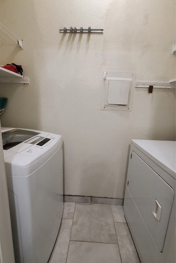 2425 Underwood Street, Unit 355 Houston, TX 77030 - Photo 10 of 17 a utility room with dryer and washer