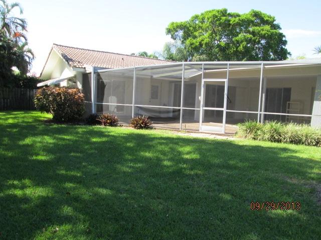 1236 Northwest 16th Street Boca Raton, FL 33486 - Photo 14 of 17 a view of a house with a yard and sitting area