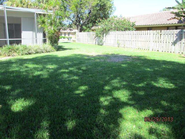 1236 Northwest 16th Street Boca Raton, FL 33486 - Photo 15 of 17 a view of a garden with a small yard