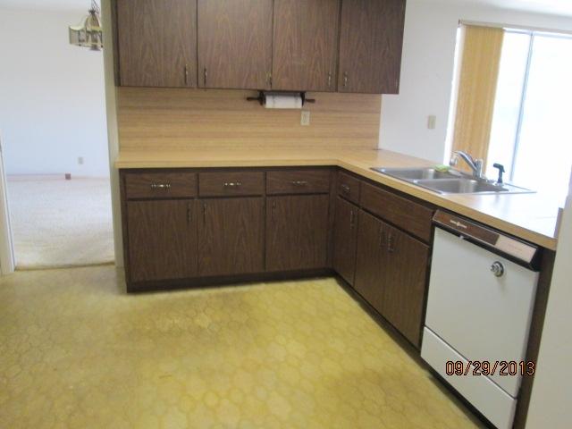1236 Northwest 16th Street Boca Raton, FL 33486 - Photo 6 of 17 a kitchen with a sink and cabinets