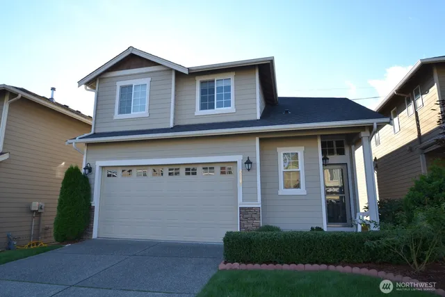 a front view of a house with garden