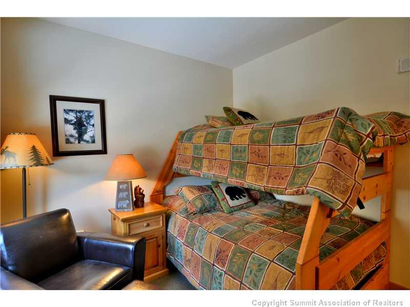 195 River Run Road, Unit 8043 Keystone, CO 80435 - Photo 13 of 25 a bedroom with a bed and cupboard