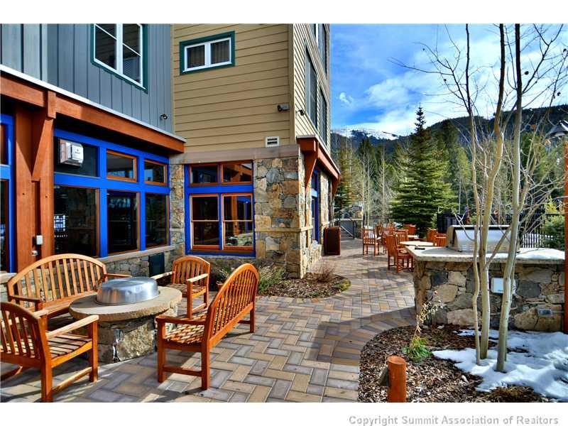 195 River Run Road, Unit 8043 Keystone, CO 80435 - Photo 20 of 25 a view of a patio with table and chairs with wooden floor and fence