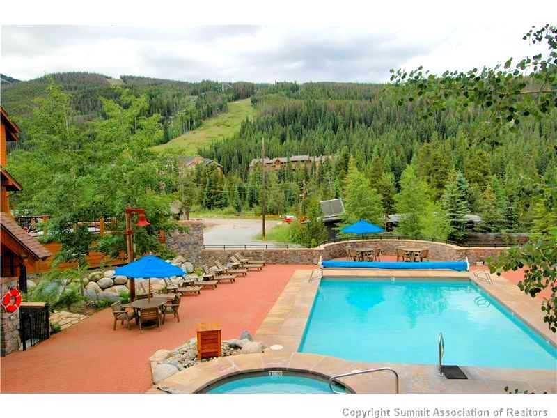 195 River Run Road, Unit 8043 Keystone, CO 80435 - Photo 21 of 25 a swimming pool with trees in the back