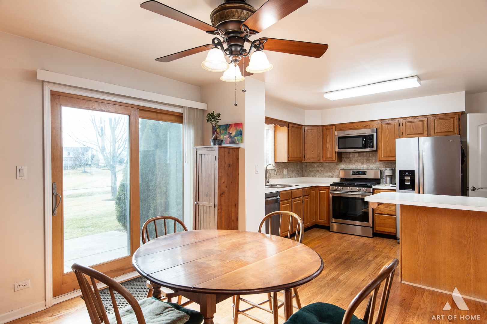 552 Stone Gate Circle, Unit 552 Schaumburg, IL 60193 - Photo 14 of 34 a view of a dining room with furniture window and wooden floor