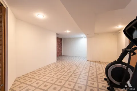 a view of a room with a washing machine and dryer