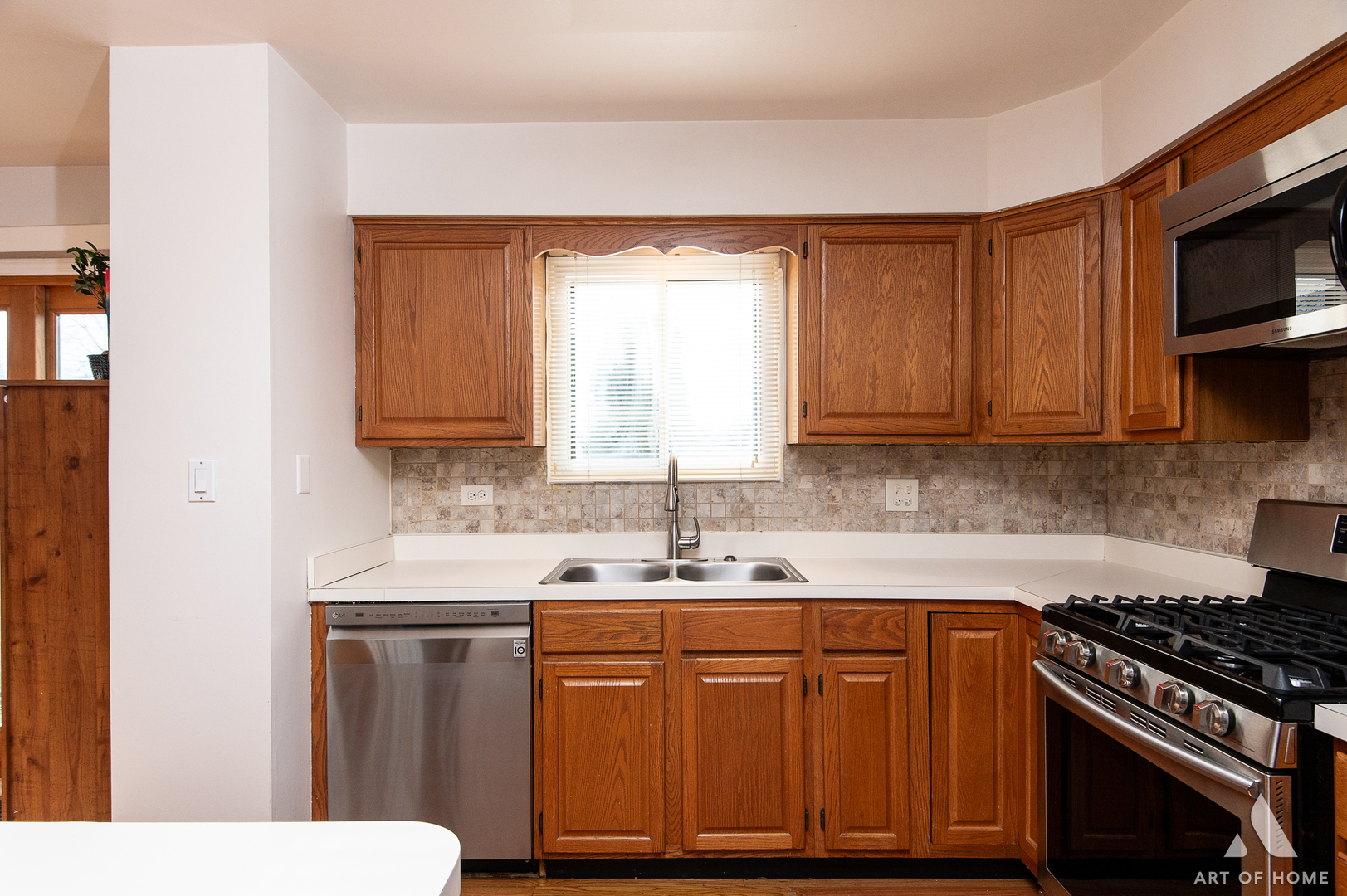 552 Stone Gate Circle, Unit 552 Schaumburg, IL 60193 - Photo 9 of 34 a kitchen with stainless steel appliances granite countertop a sink stove and microwave