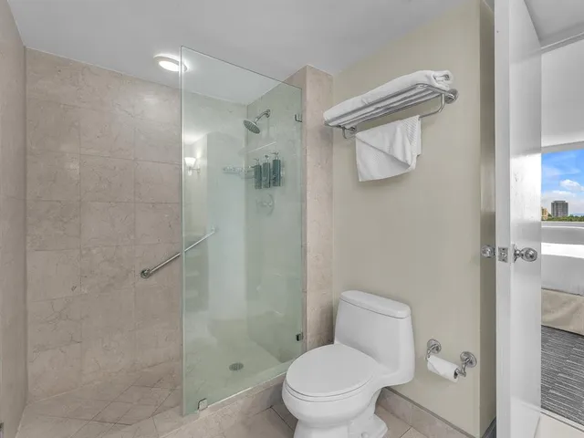 a view of a lake with tall building