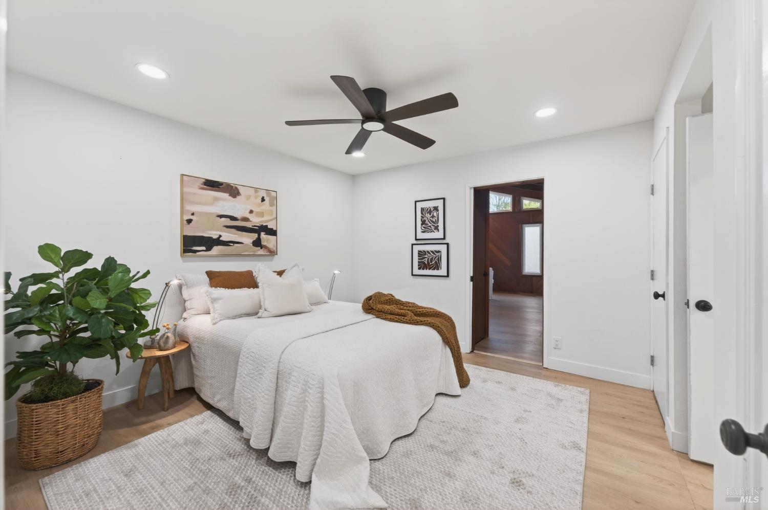 2447 Rigdon Street Napa, CA 94558 - Photo 40 of 79 a bedroom with a bed and a potted plant