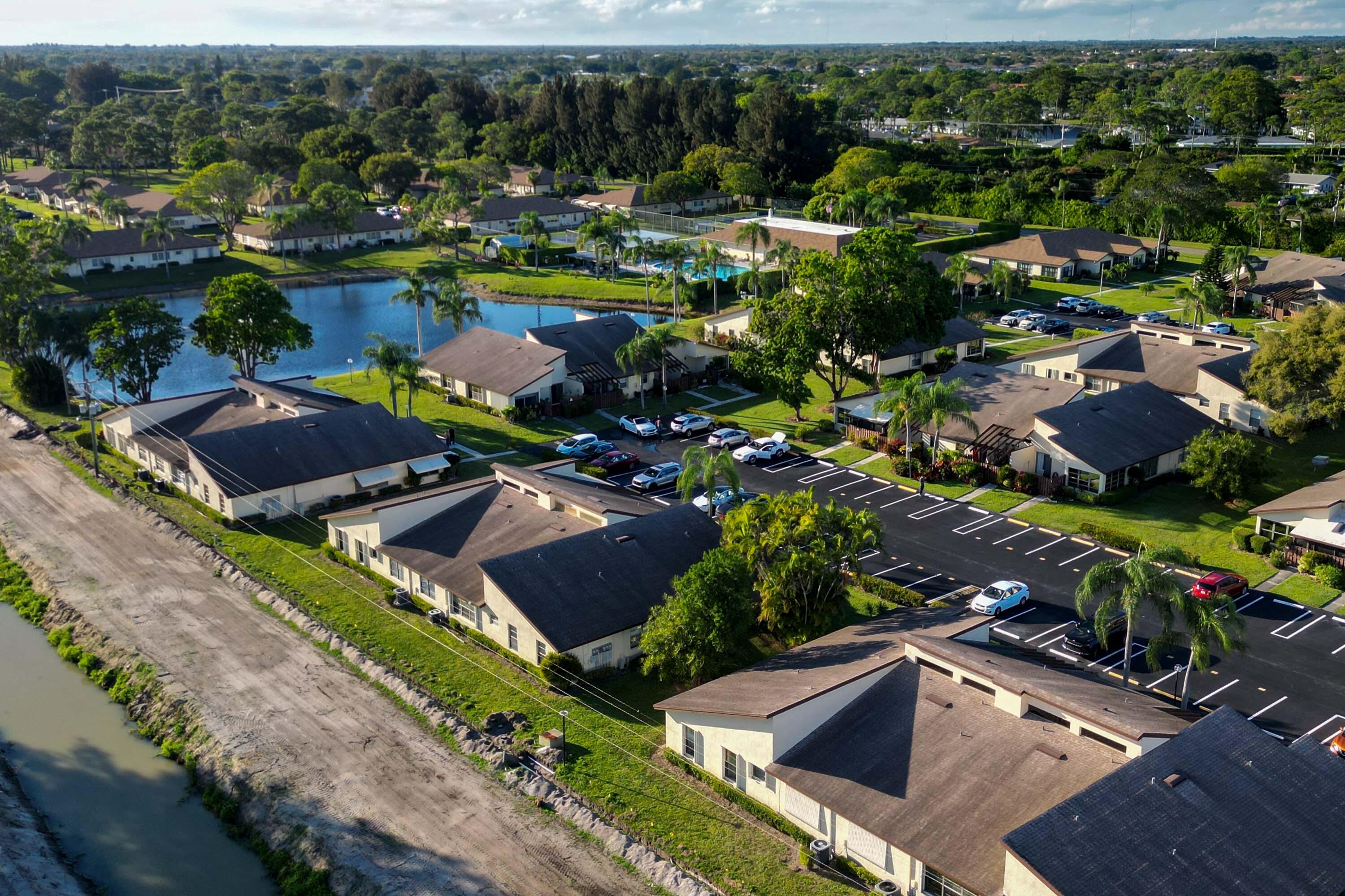 5080 Nesting Way, Unit A Delray Beach, FL 33484 - Photo 30 of 37 an aerial view of residential houses with outdoor space