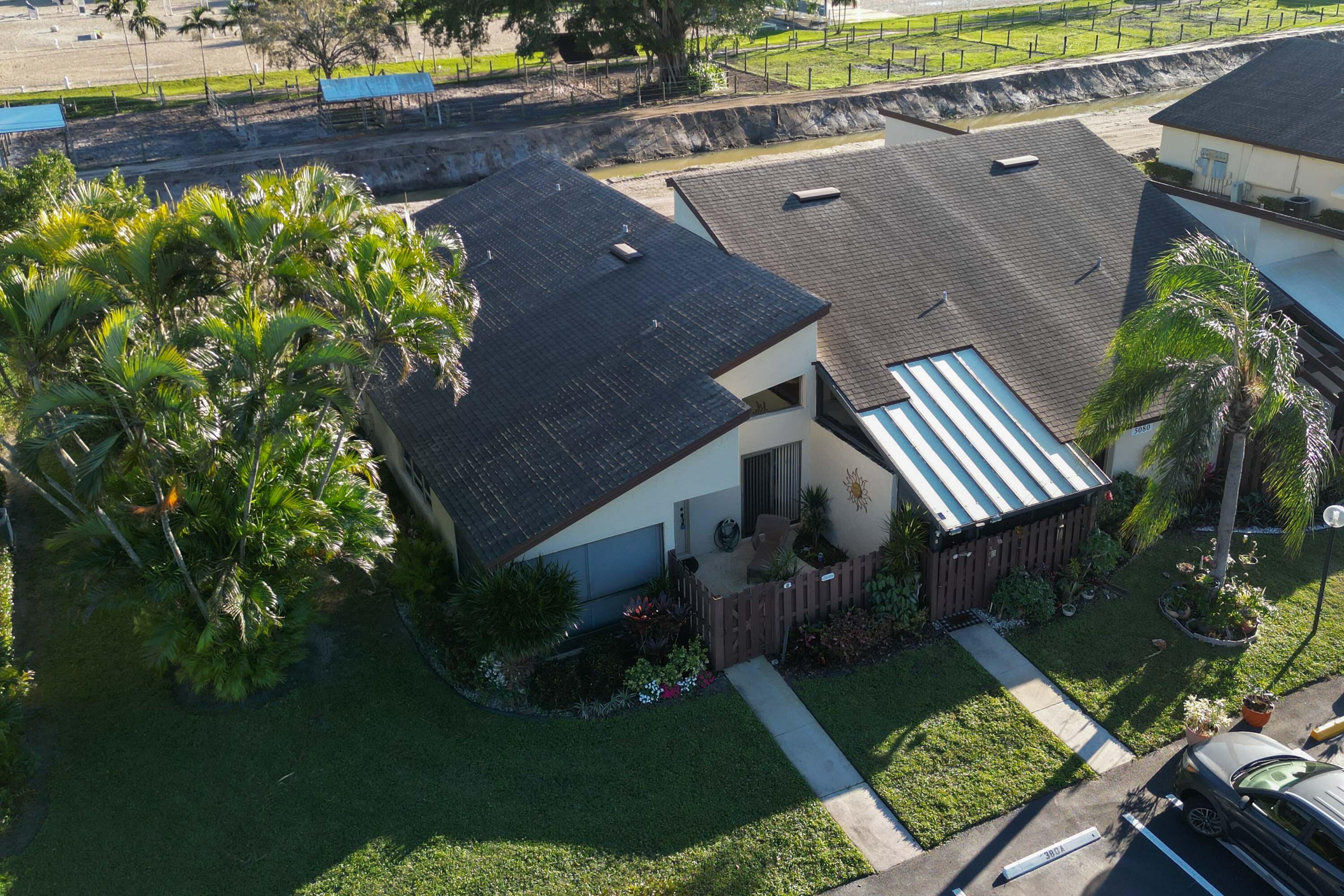 5080 Nesting Way, Unit A Delray Beach, FL 33484 - Photo 33 of 37 an aerial view of a house having yard