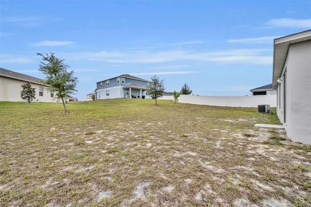 a view of ocean with a big yard