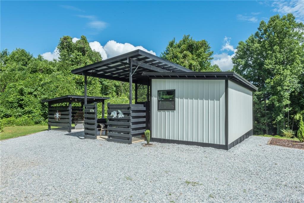 787 Ridge Road Marion, NC 28752 - Photo 2 of 47 a view of a house with a yard and sitting area