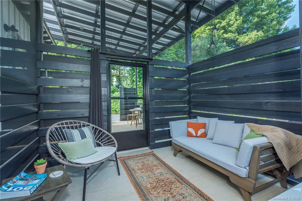 787 Ridge Road Marion, NC 28752 - Photo 13 of 47 a outdoor living space with furniture and a rug