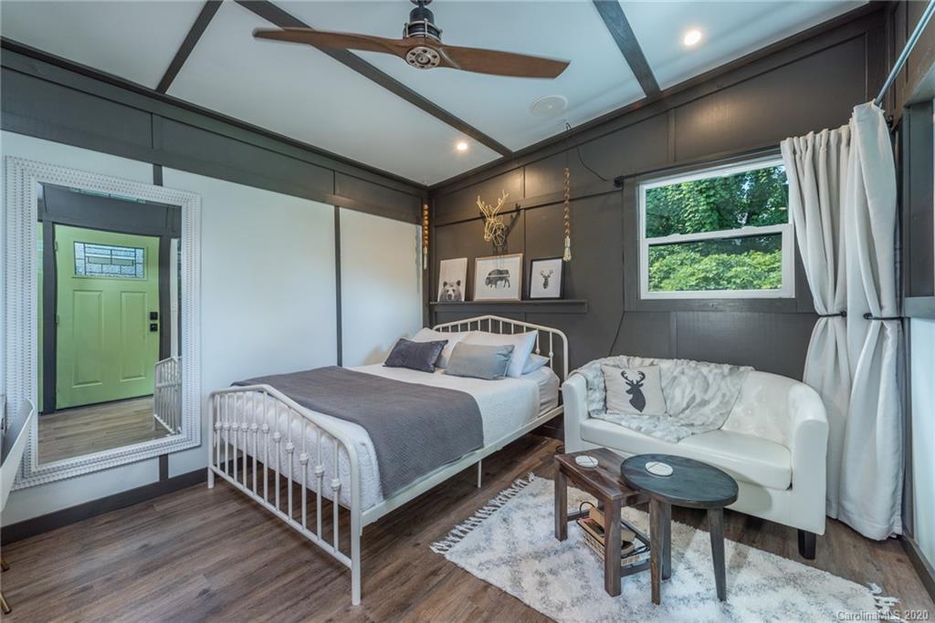 787 Ridge Road Marion, NC 28752 - Photo 14 of 47 a bed room with a bed and a window