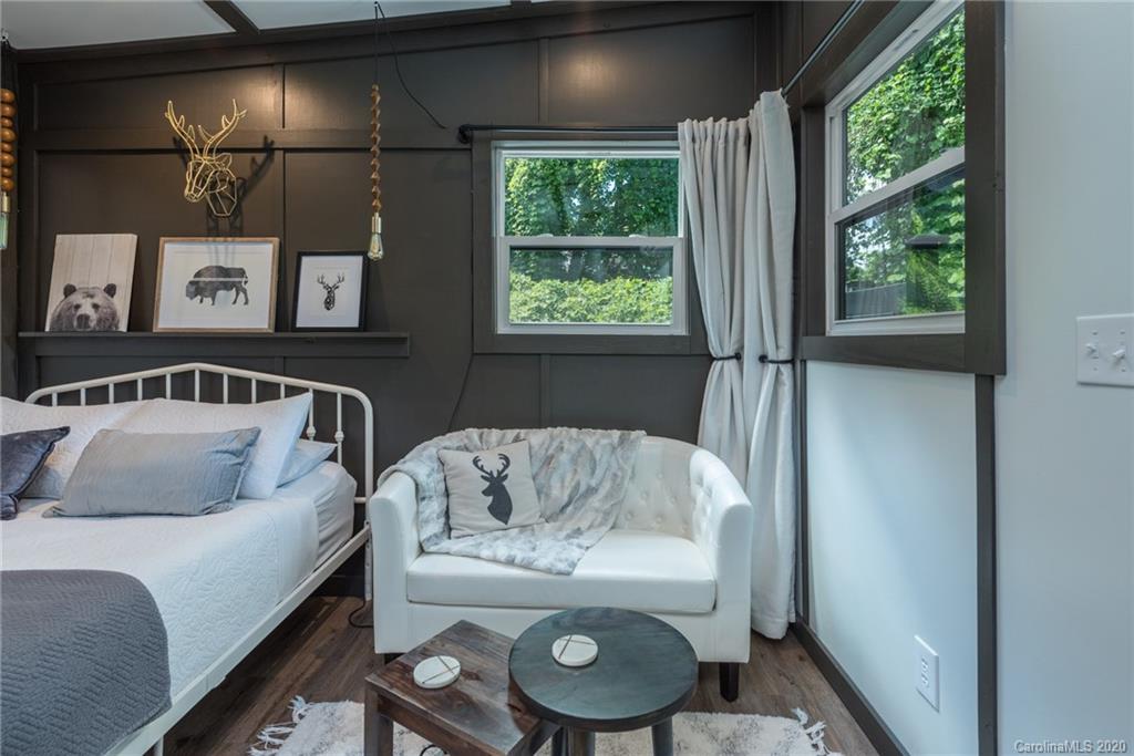 787 Ridge Road Marion, NC 28752 - Photo 15 of 47 a bedroom with a bed and window