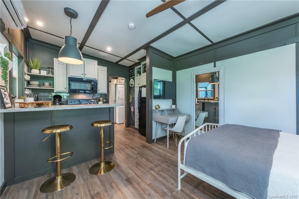 787 Ridge Road Marion, NC 28752 - Photo 17 of 47 a dining room with stainless steel appliances kitchen island granite countertop furniture