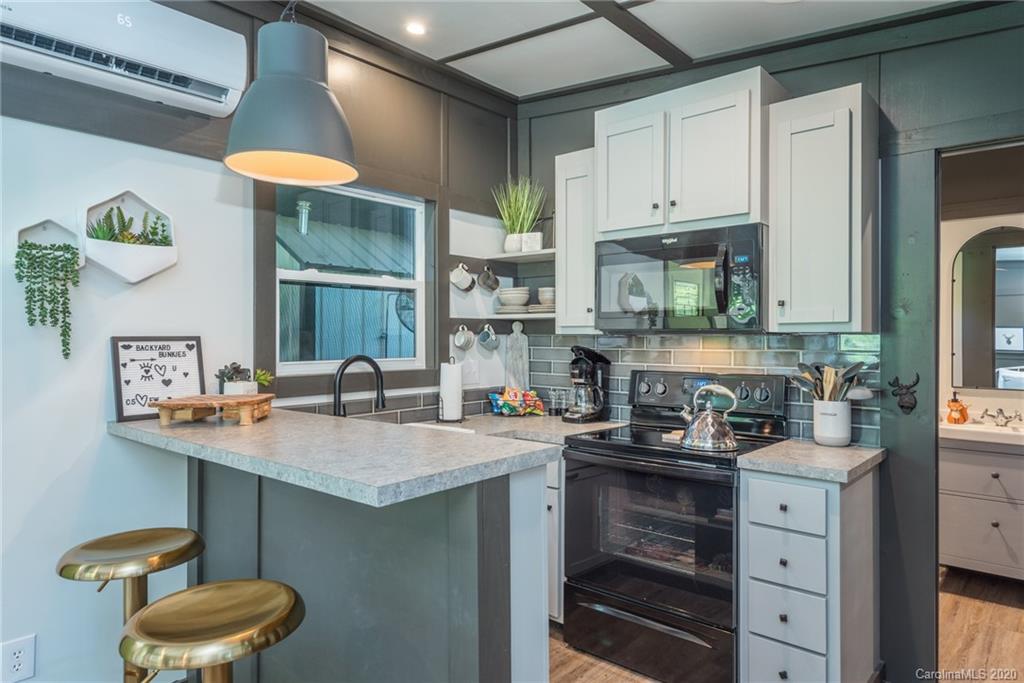 787 Ridge Road Marion, NC 28752 - Photo 19 of 47 a kitchen with a sink cabinets and window