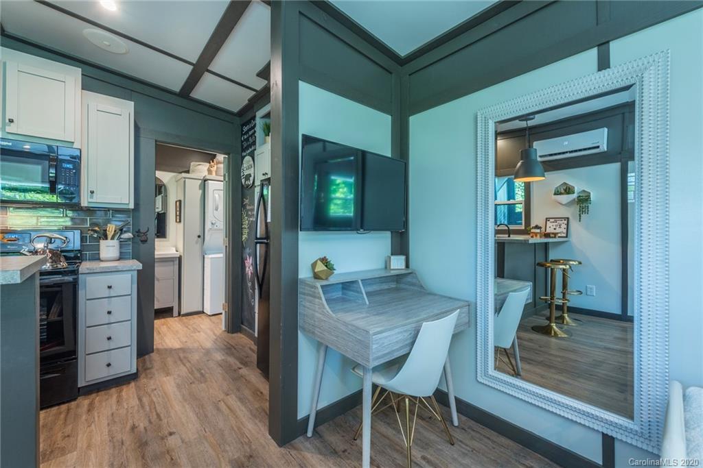 787 Ridge Road Marion, NC 28752 - Photo 20 of 47 a kitchen with a table and chairs in it