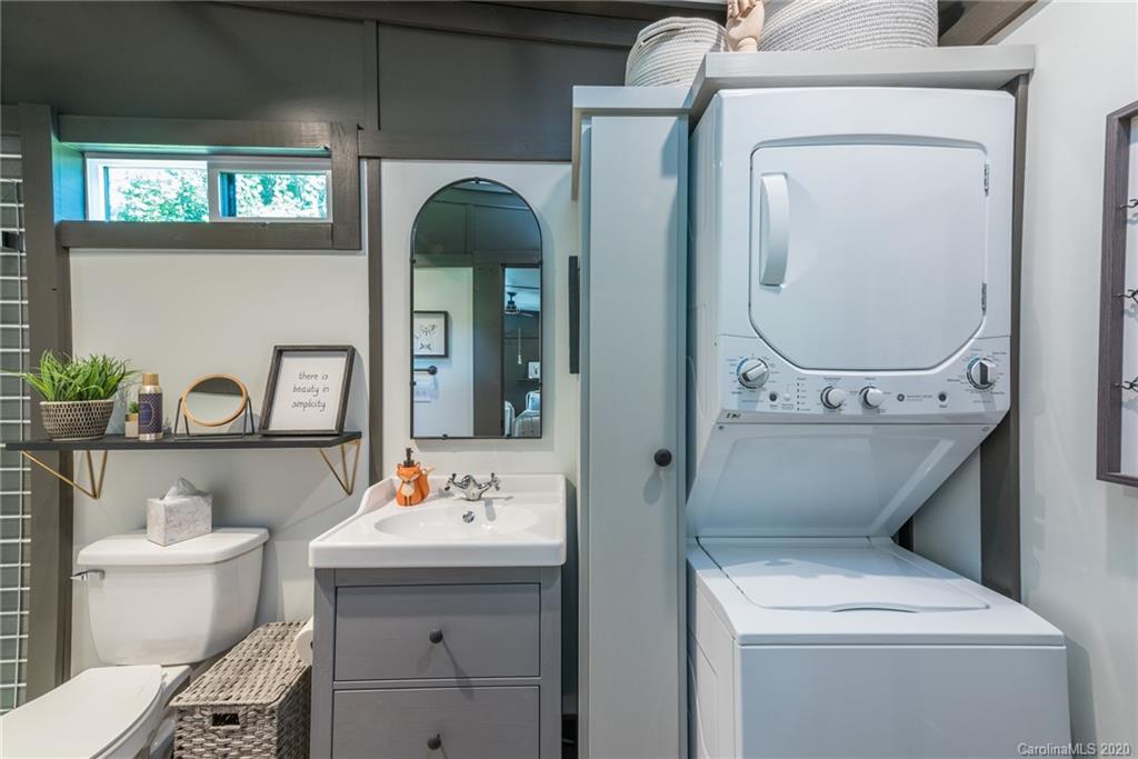 787 Ridge Road Marion, NC 28752 - Photo 24 of 47 a bathroom with a toilet sink and mirror