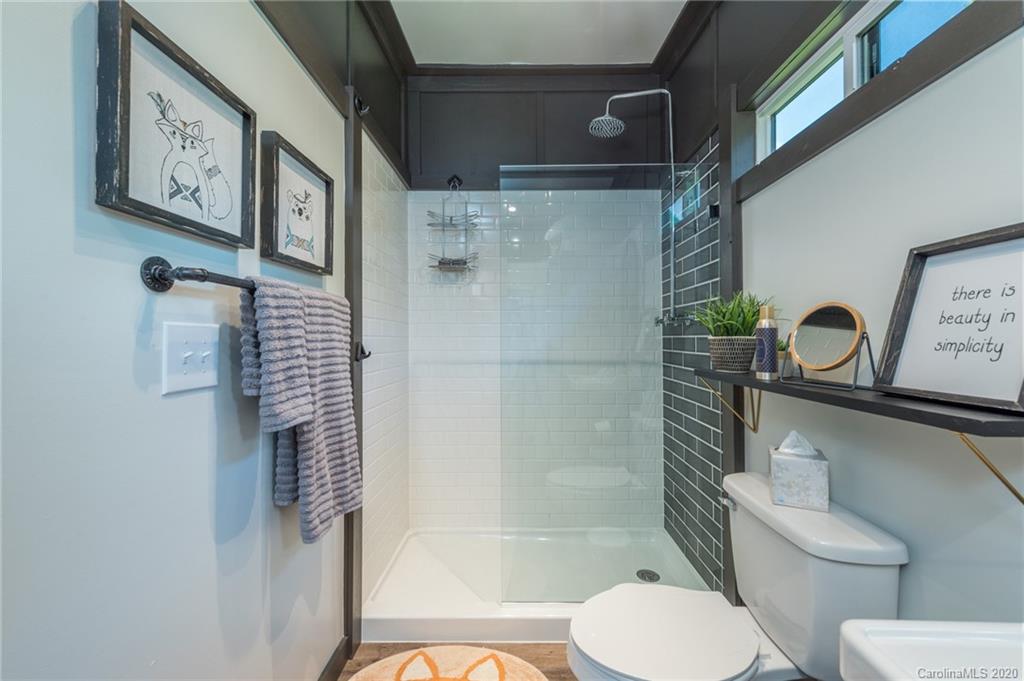 787 Ridge Road Marion, NC 28752 - Photo 26 of 47 a bathroom with a toilet and a shower