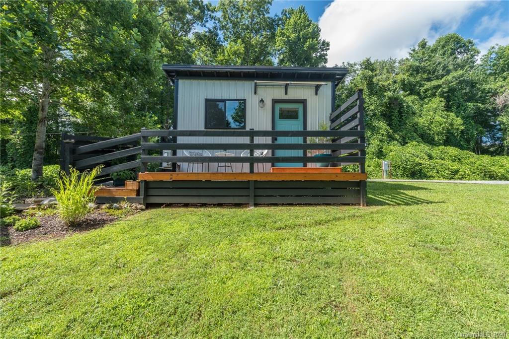787 Ridge Road Marion, NC 28752 - Photo 27 of 47 a backyard of a house with wooden fence and trees