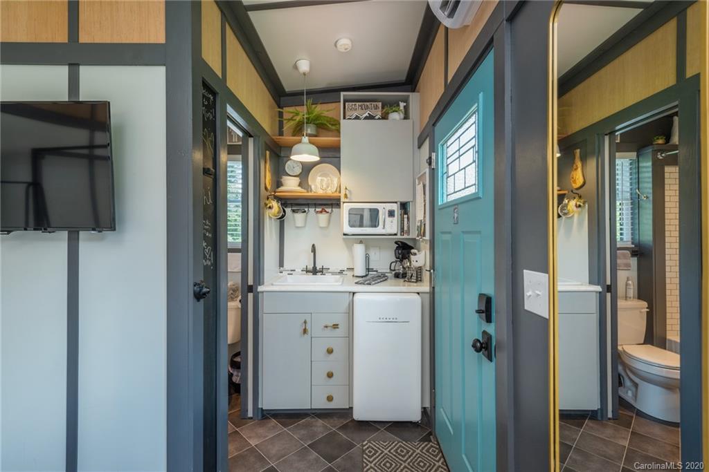 787 Ridge Road Marion, NC 28752 - Photo 39 of 47 a view of walk in closet with clothes and shoes