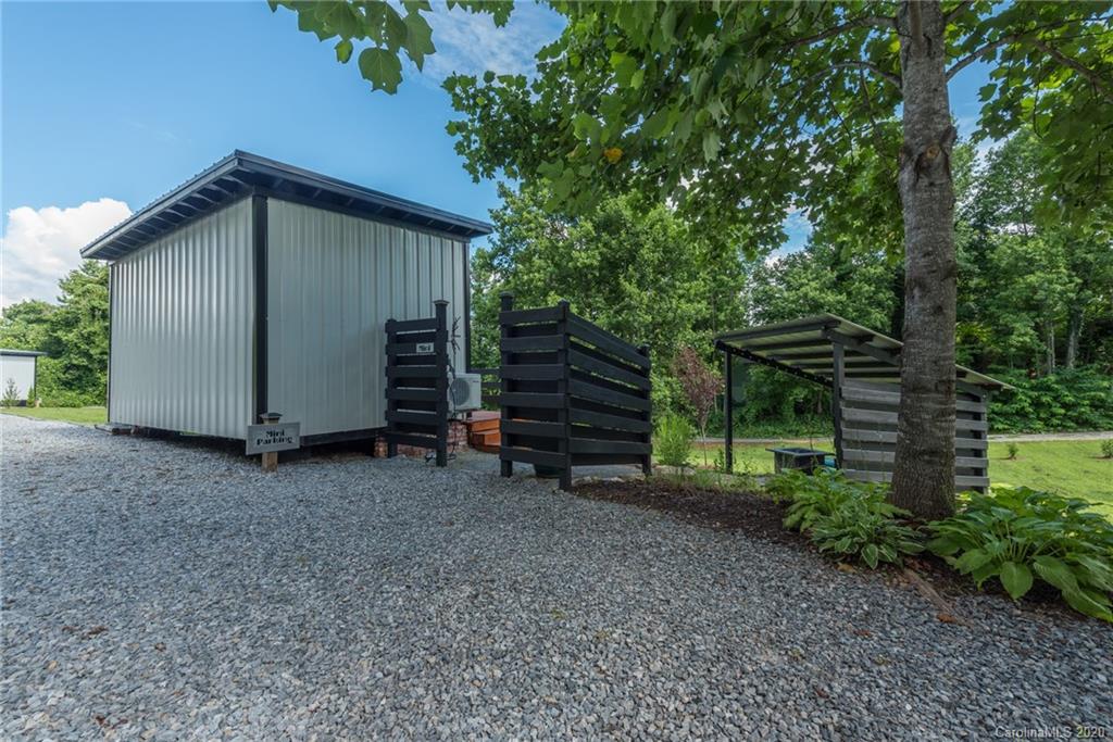787 Ridge Road Marion, NC 28752 - Photo 46 of 47 a view of backyard with potted plants and a large tree