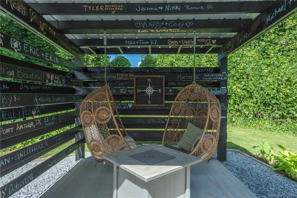787 Ridge Road Marion, NC 28752 - Photo 7 of 47 a wooden bench sitting in a yard