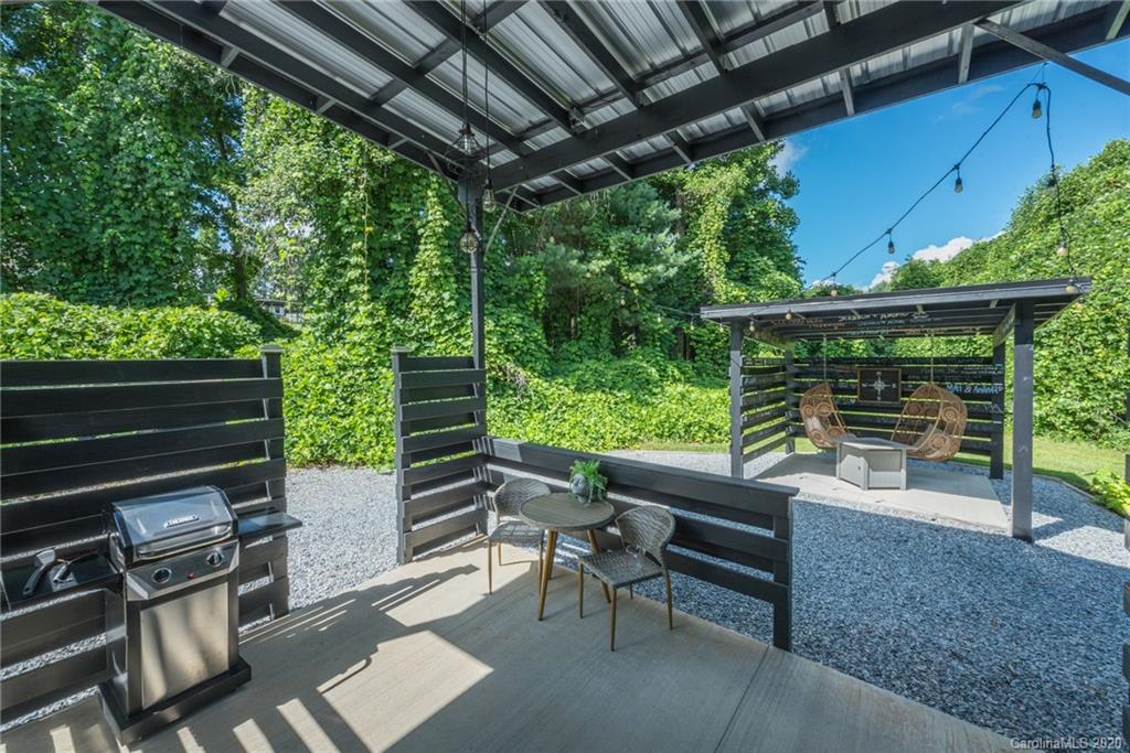 787 Ridge Road Marion, NC 28752 - Photo 9 of 47 a patio with glass top table and chairs