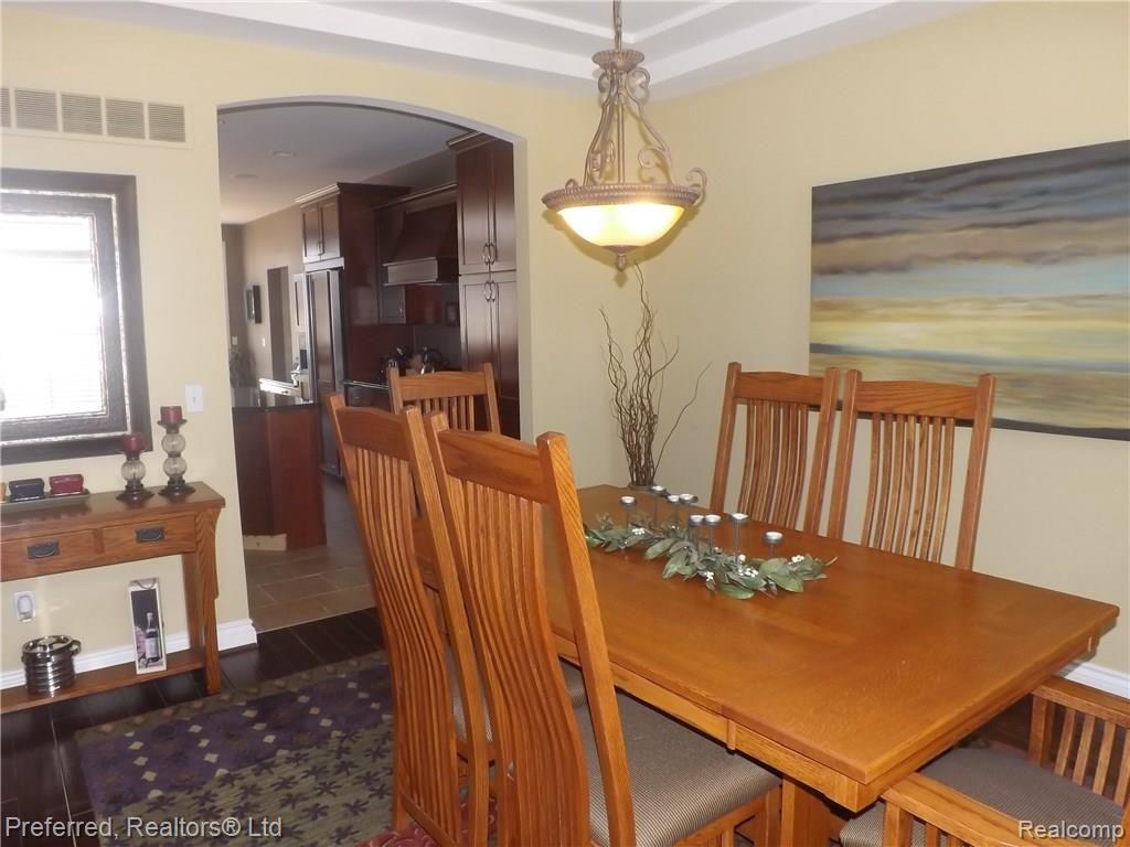 147 West Reed Lk Court Commerce Township, MI 48382 - Photo 12 of 46 Arched Entry To Dining Room