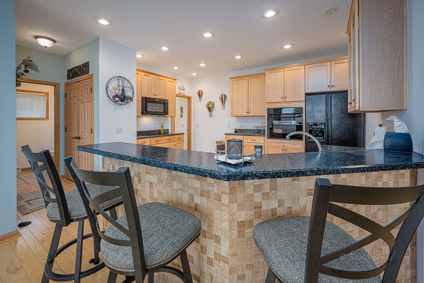 4 Saddleback Road Galena, IL 61036 - Photo 11 of 30 a kitchen with granite countertop kitchen island stainless steel appliances a table and chairs in it