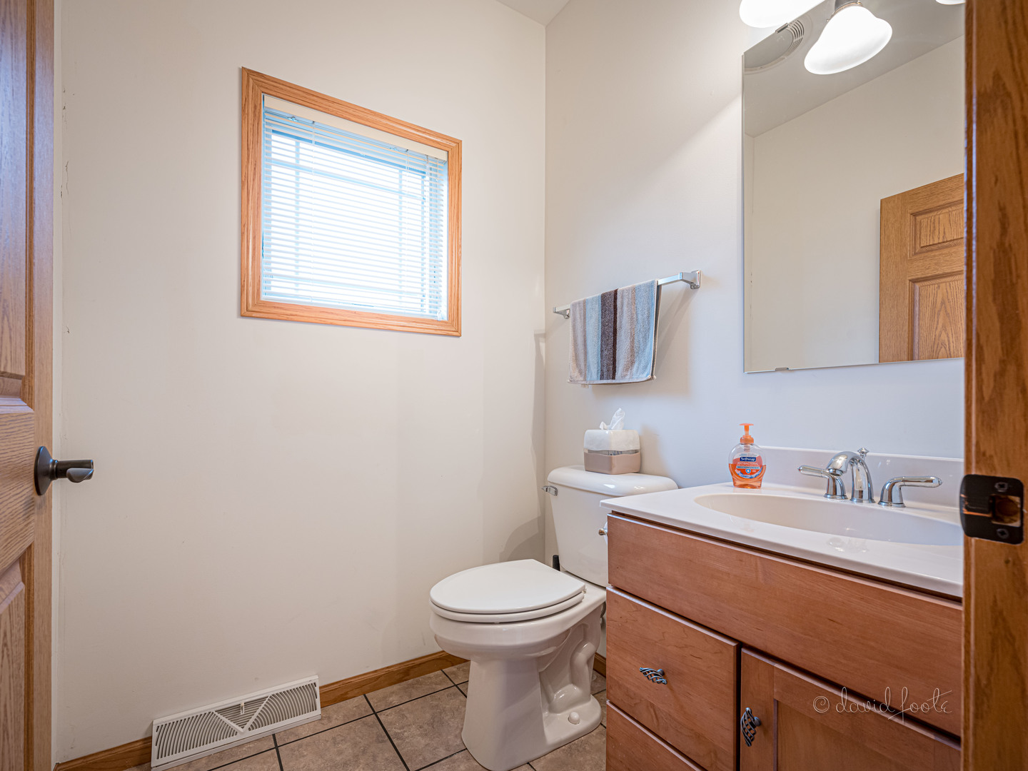4 Saddleback Road Galena, IL 61036 - Photo 14 of 30 a bathroom with a toilet a sink and mirror