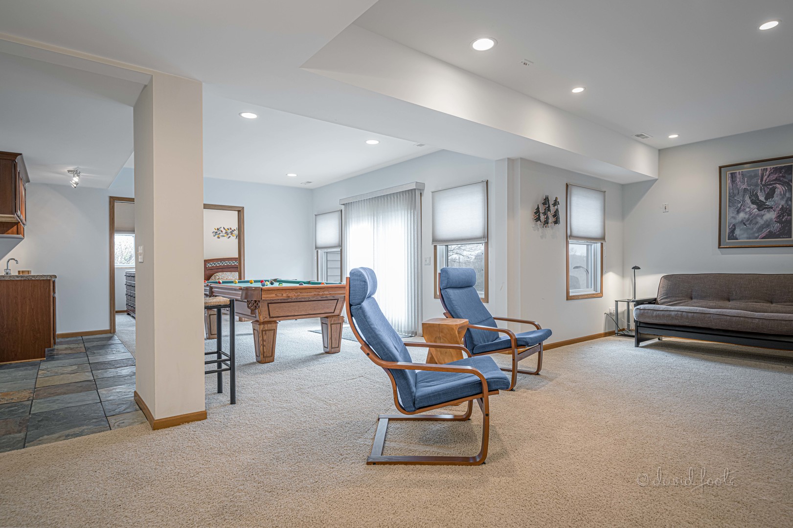 4 Saddleback Road Galena, IL 61036 - Photo 22 of 30 a living room with furniture and a kitchen area