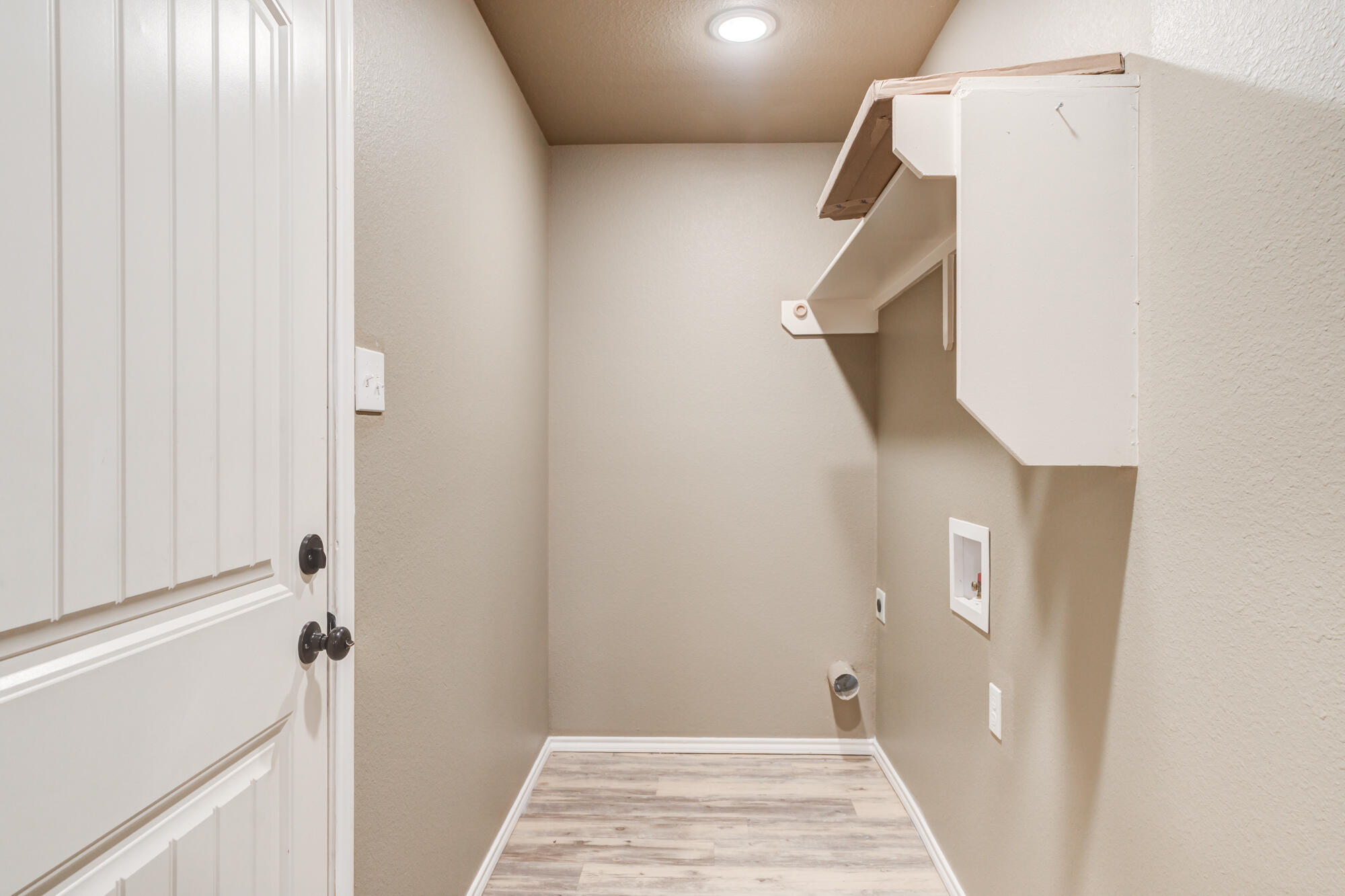 2832 East 7th Street Lubbock, TX 79403 - Photo 15 of 25 a view of a hallway with closet and door