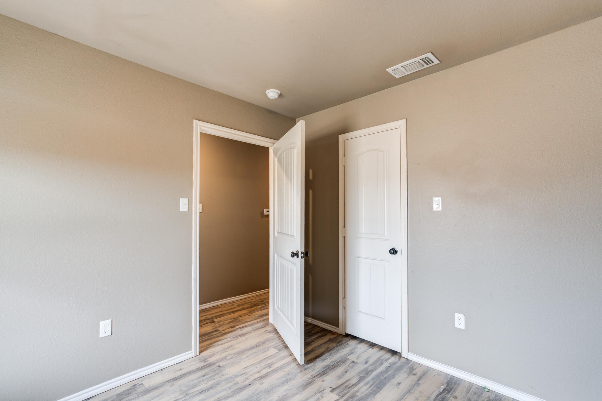 2832 East 7th Street Lubbock, TX 79403 - Photo 21 of 25 wooden floor in an empty room with wooden floor