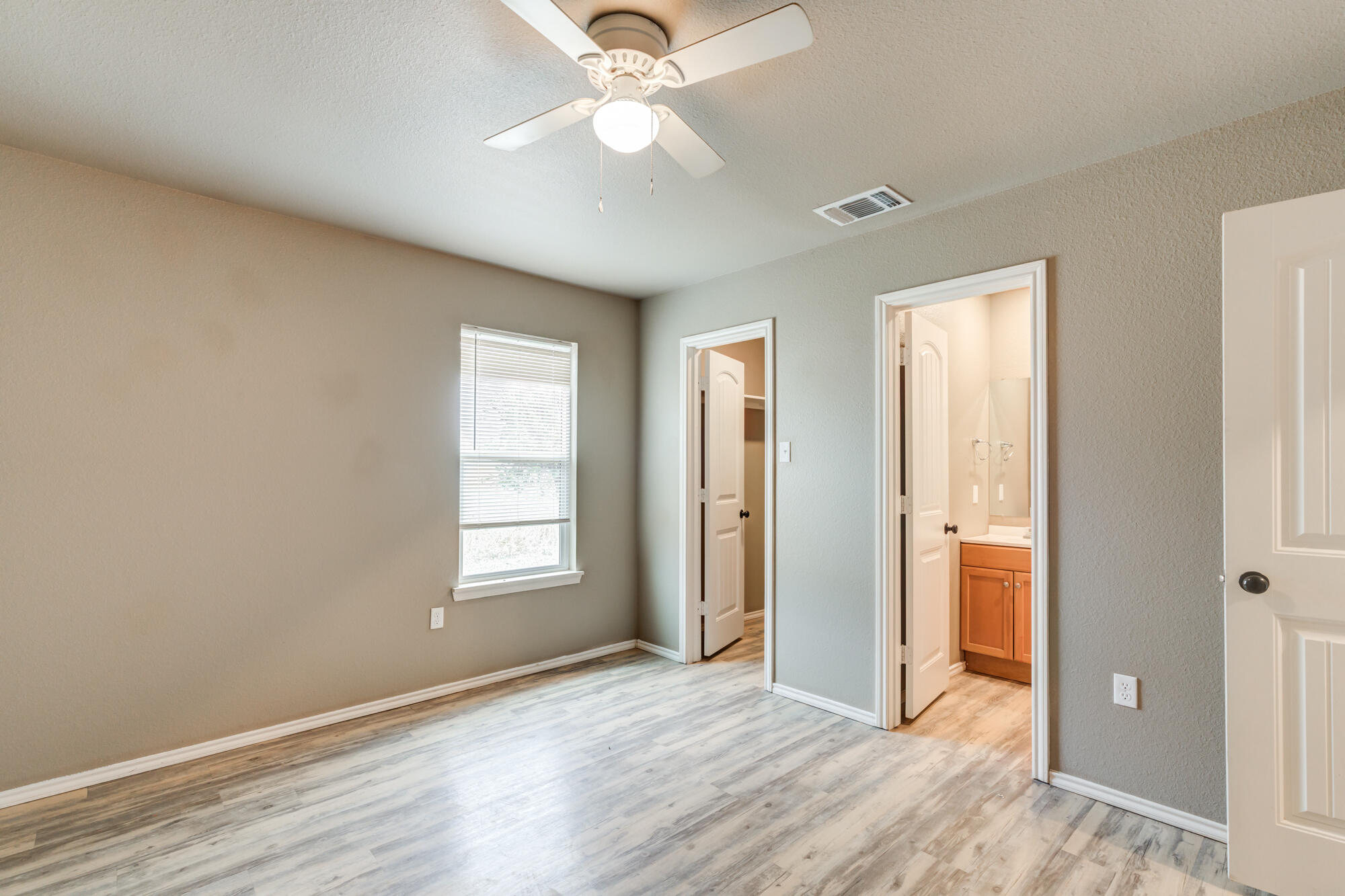 2832 East 7th Street Lubbock, TX 79403 - Photo 23 of 25 a view of an empty room with window and wooden floor