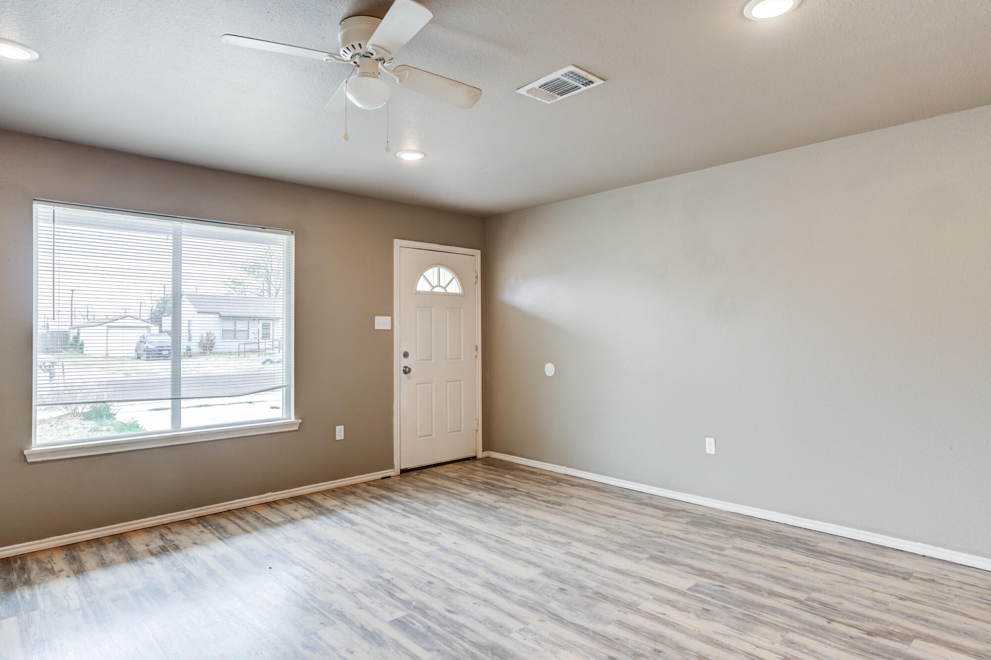 2832 East 7th Street Lubbock, TX 79403 - Photo 5 of 25 an empty room with windows and closet