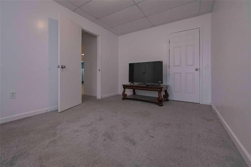 113 Millwheel Drive Villa Rica, GA 30180 - Photo 27 of 34 a view of room with workspace and a flat screen tv