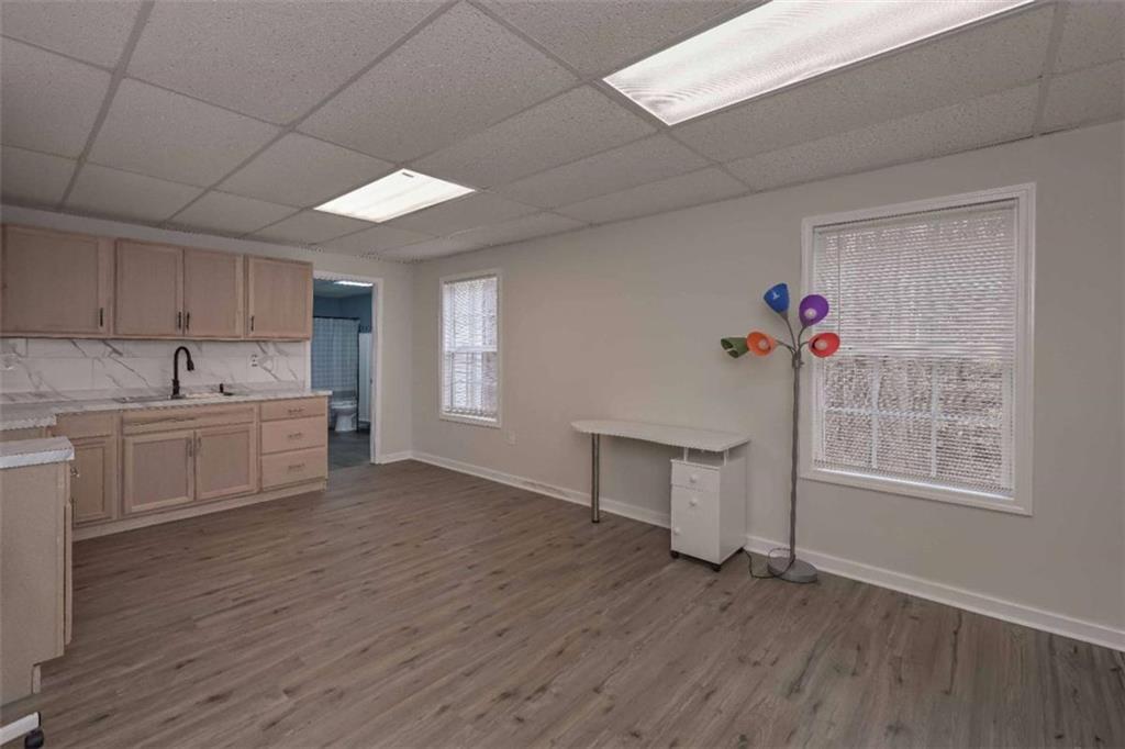 113 Millwheel Drive Villa Rica, GA 30180 - Photo 29 of 34 a kitchen with a wooden floor and white walls